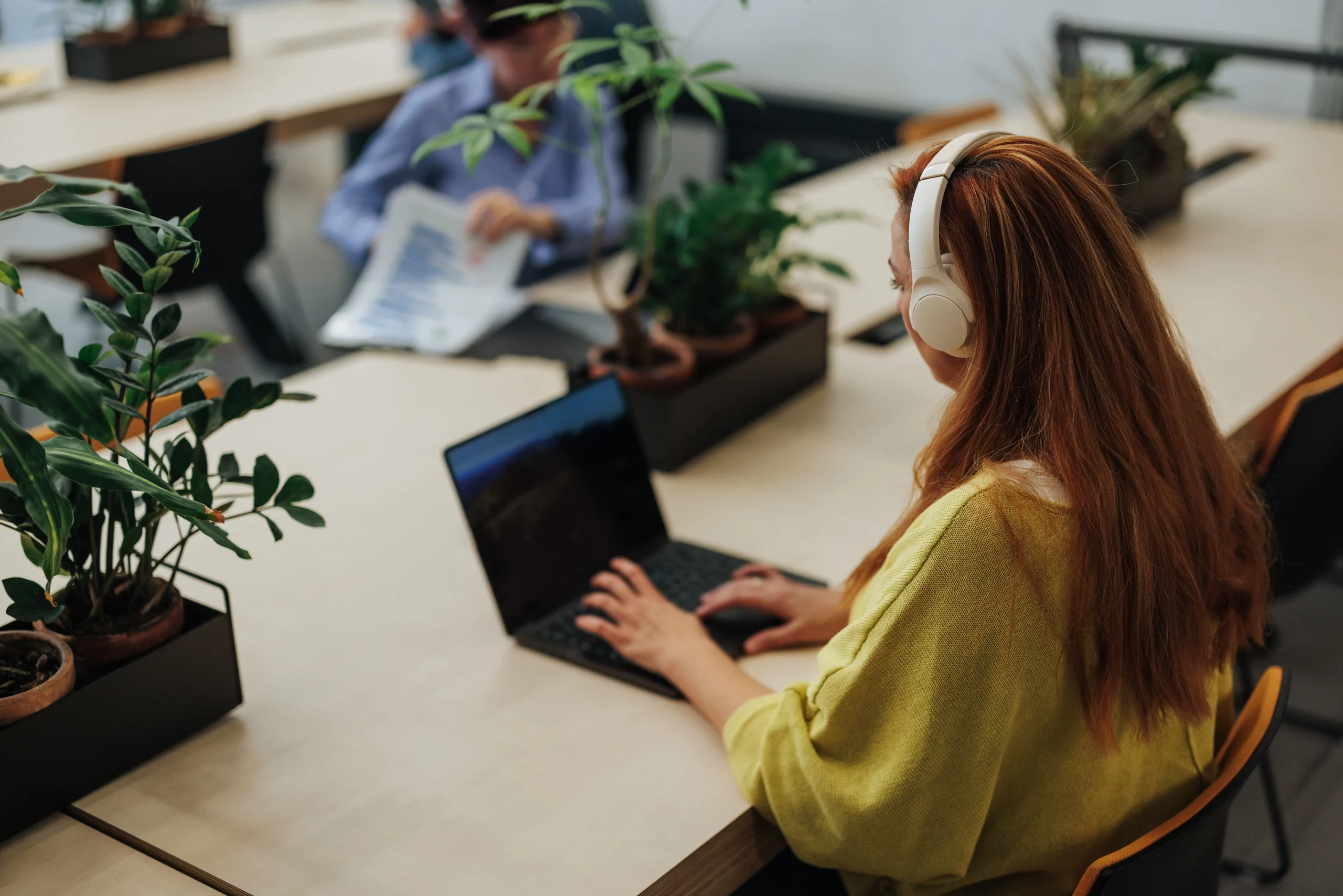 Young Woman With Headphones Browsing Online